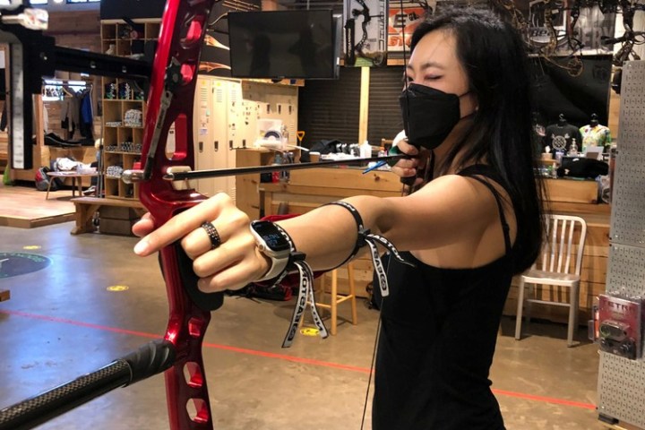 a woman standing in front of a building